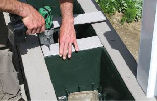 Figure 9. Screws hold down the surface facing, allowing it to be removed should the homeowners want to pull out the liners.
