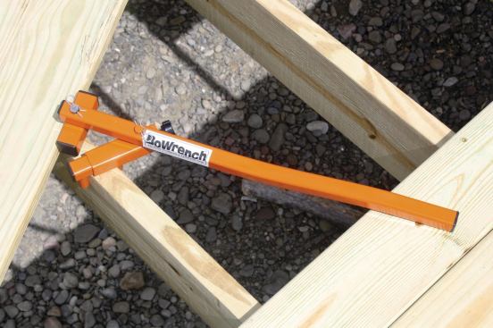 The BoWrench allows you grasp the top of a joist and pry bowed deck boards into position.