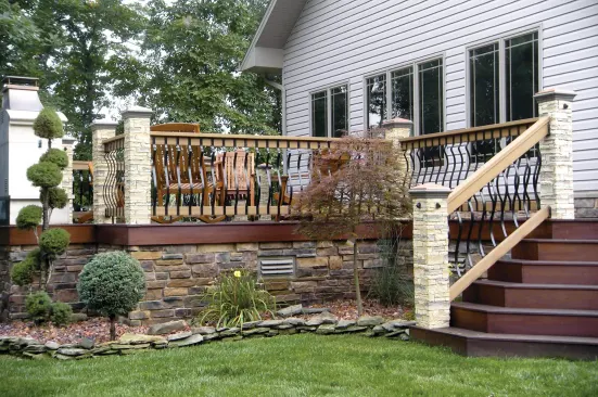 Note the vent in the stone-clad skirting. Good air circulation under the deck was necessary for the ipe decking. 
