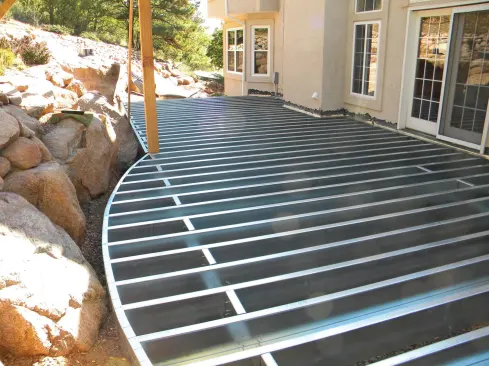 Complex framing can take longer with steel than with wood. For decks like the one pictured above, the steel has to be cut to length on site. Plus, complicated designs have a lot of screwed connections, which take longer than gun-nailed wood connections.