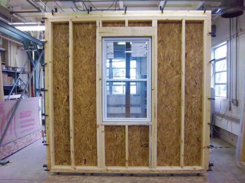 1) a framed wall with a window