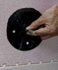 Figure 2. Plan ahead to attach to ICFs. A plastic anchor tunnel screws into a hole drilled in the ICF. The tunnel holds an anchor bolt square to the wall, and the concrete is poured around it. Tunnels are installed in a staggered line to minimize forces that might split the ledger.