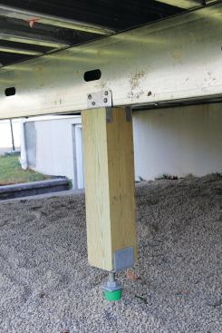 Wood support posts attach to LGS beams with hardware that’s similar to what would be used with wood framing.