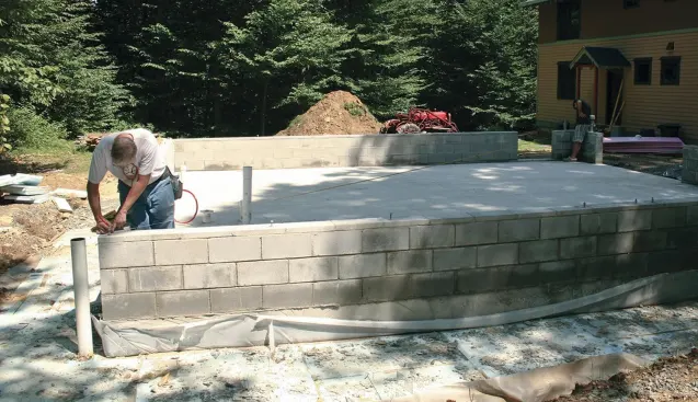 The framed garage walls are supported on an 8-inch block knee wall.