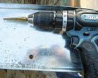 Figure 6. Predrill the ledger for the 1/2-inch lags using a step drill.