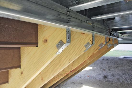 Stair stringers are typically made of wood, which is more economical and easier to wrap with finish materials.