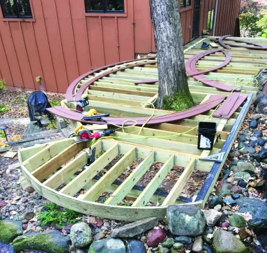 Where the curved edge would receive fascia trim, the author built up the rim joist with three layers of 1/2-inch PT plywood ripped to width.