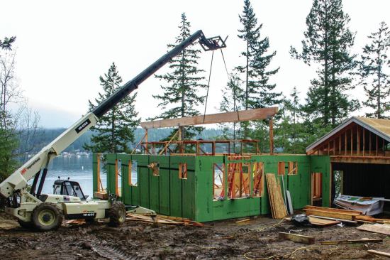 For larger beams that require placing over greater distances and to more control, the author supports the beams with rigging straps.