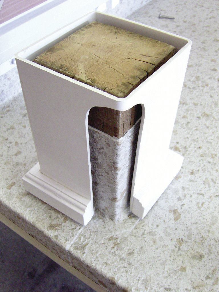 When wood posts must penetrate a roof deck, the flashing and roof covering are typically lapped up all four sides of the post and covered by a post sleeve.