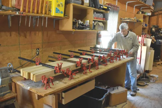 The planed lumber is glued up into parts for the stiles and rails. Planing them first ensures a clean and flat surface.