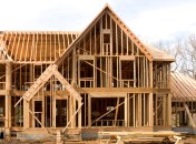 Large, McMansion-type house under construction in framing phase