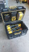 With the DeWalt Tough-System Charger box open, you can see the storage space and the protective lid prop at right.