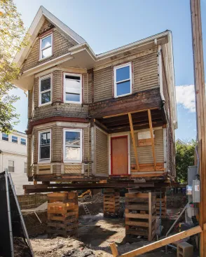 Groundwater conditions precluded digging a deeper basement. Instead, the author and his clients opted for raising the house on a new foundation.